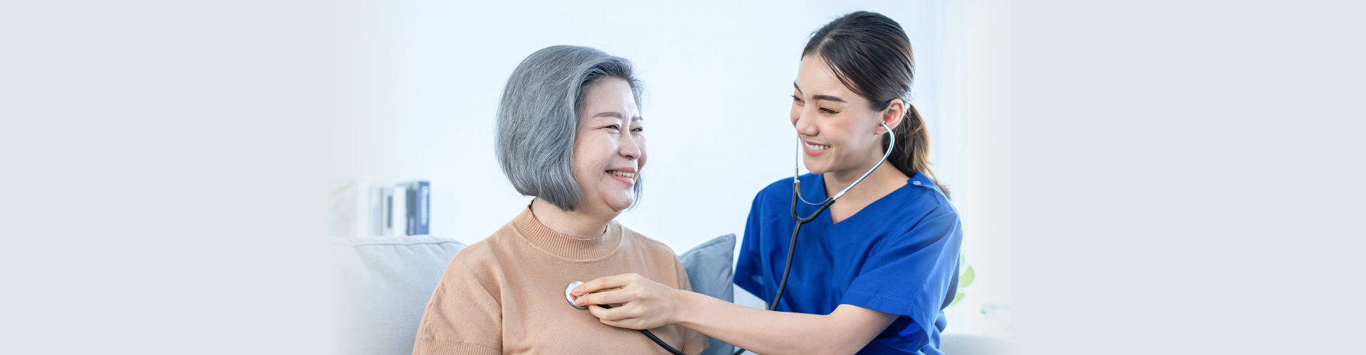 healthcare staff checking the health of senior woman patient