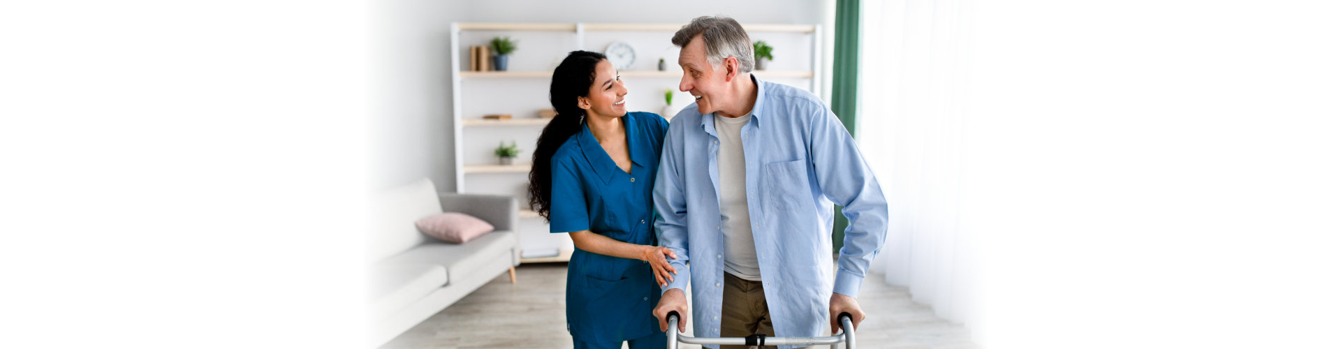 healthcare staff helping senior man patient to walk