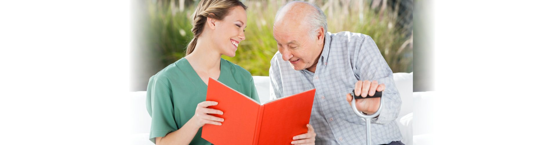 senior man and the healthcare staff reading book