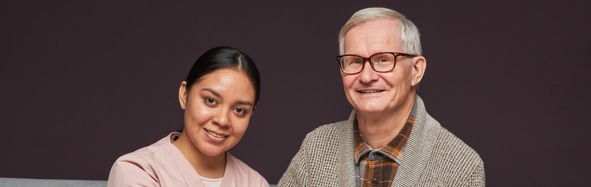 caregiver staff and elderly man